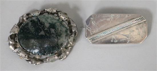 A Victorian silver-framed moss agate brooch and an engraved silver brooch